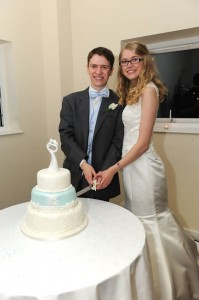 James and Rachel cut their wedding cake - designed by cake decorating expert and alumnus Sam Copeland