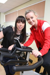 Beth Tweddle and Georgia Lush (Level 3 Sports Student) on exercise bike