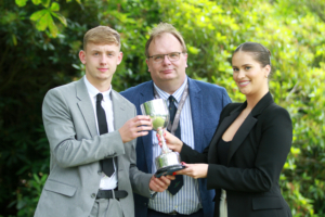 Sport student Sebastian Muszynski, winner of the Cross College GJ England Trophy for Most Contribution to College Sporting Activities with Principal Marcus Clinton and Business alumnus Belle Farebrother.