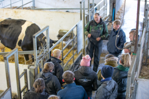 Delegates get a close-up look at herd management during a farm visit. The ADTP programme balanced classroom theory with practical on-farm demonstrations, focusing on everything from calf care to advanced genetics.